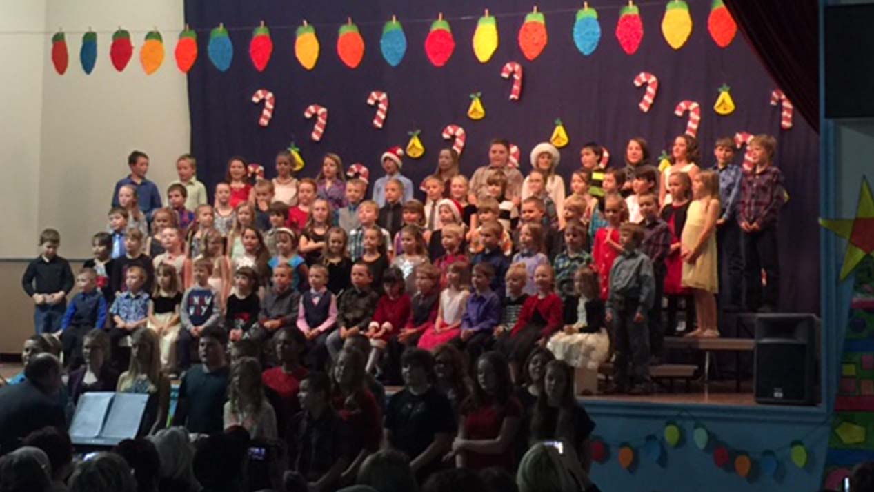 Children's school choir standing on risers